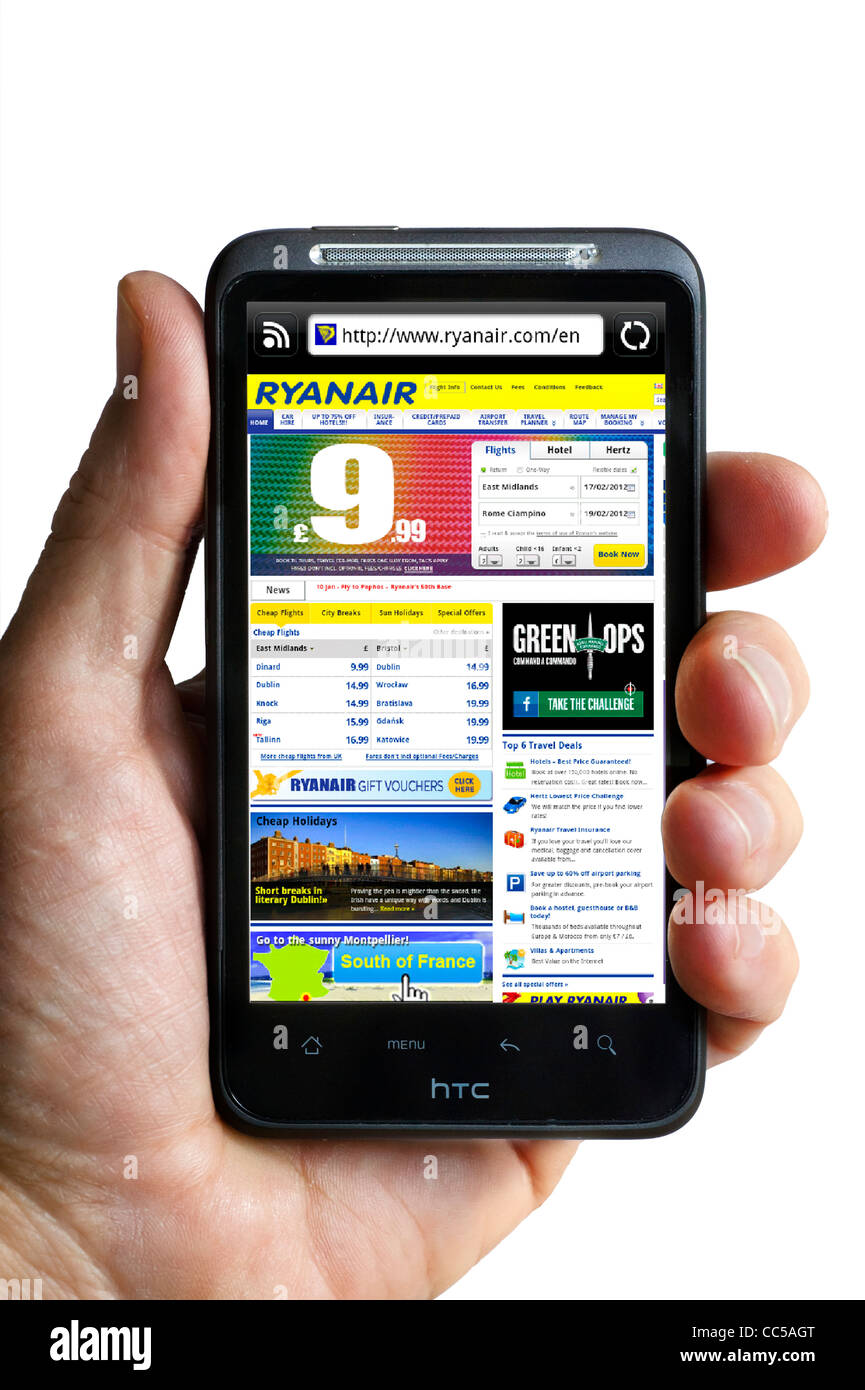 Booking a flight on the Ryanair website on an HTC smartphone Stock Photo