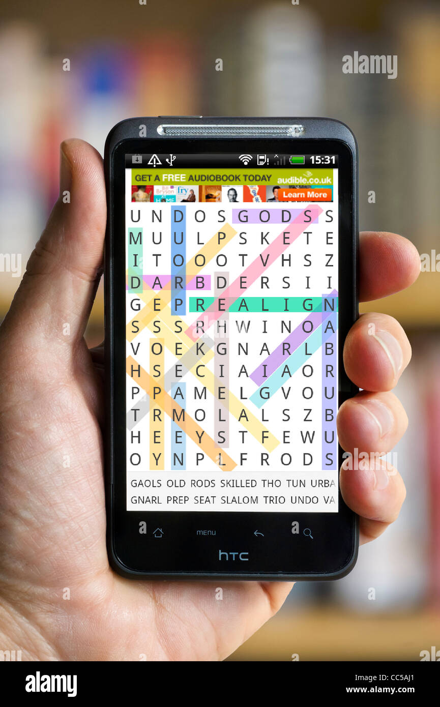 Playing Word Search on an HTC smartphone Stock Photo