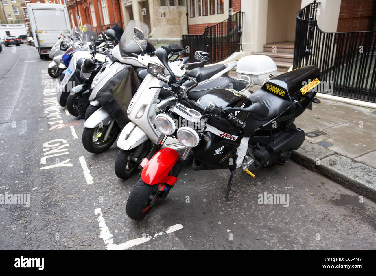 motorcycle and motorbike only parking area in knightsbridge London England UK United kingdom Stock Photo