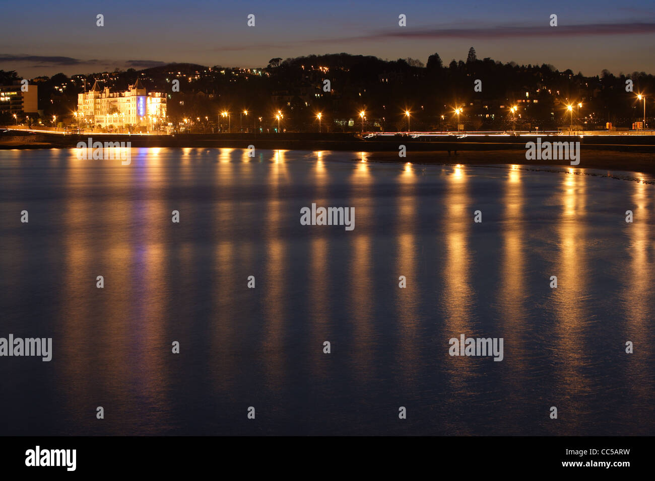 Evening scens of the Grand hotel in Torquay, Devon Reflecting in the calm water Stock Photo