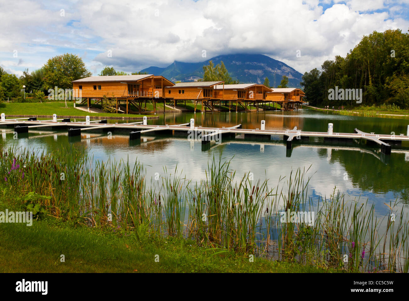 Wooden holiday homes and boat moorings in Chanaz on the banks of the Canal de Savieres in Savoie south eastern France Stock Photo