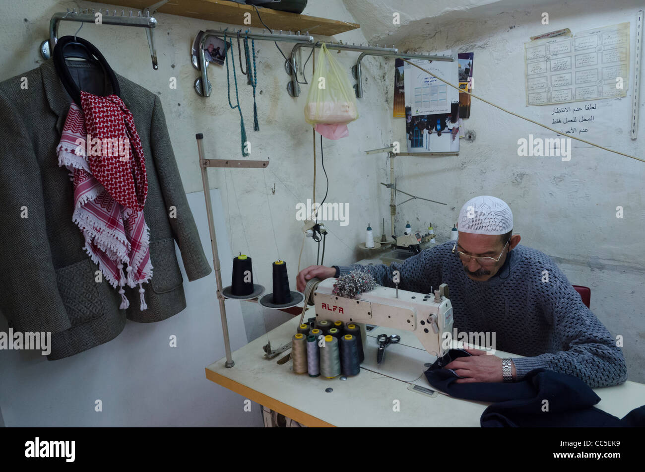 Palestinian taylor in his workshop. musilim quarter. Jerusalem Old City. israel Stock Photo