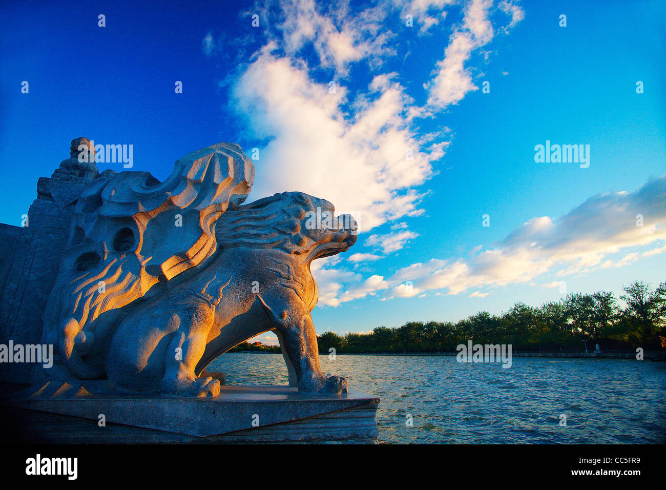 Stone sculpture of Qilin on the Seventeen-Arch Bridge, Summer Palace, Beijing, China Stock Photo