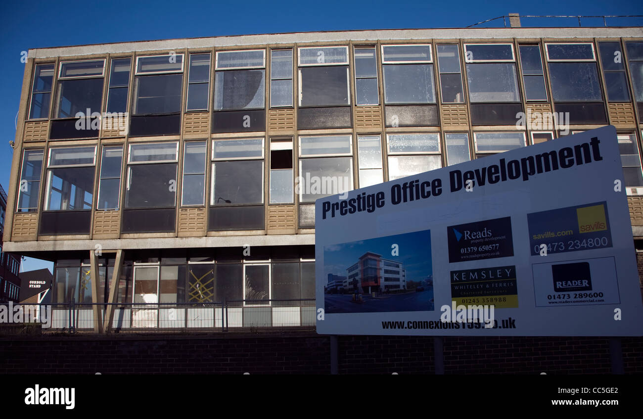 Sign advertising new prestige office development by empty 1960s office, Ipswich, England Stock Photo