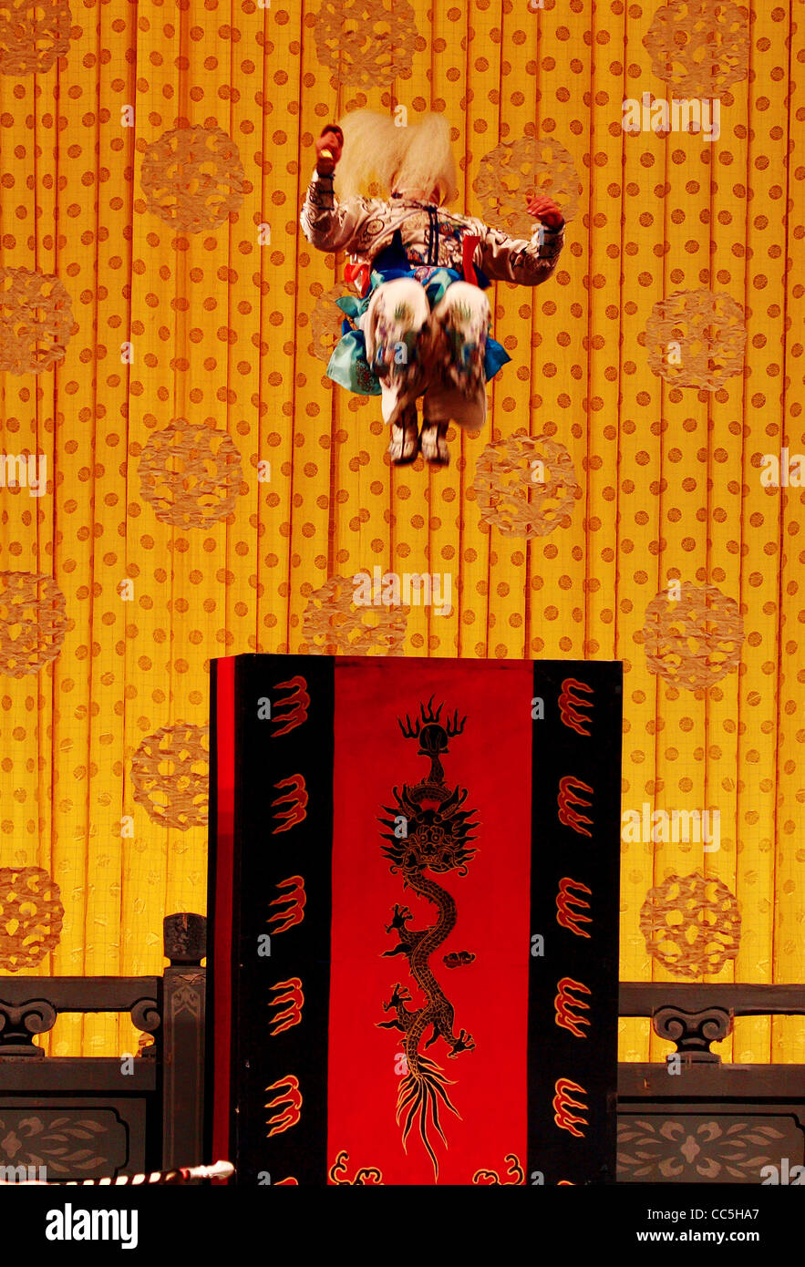 Male Peking opera performer in the air, Beijing, China Stock Photo
