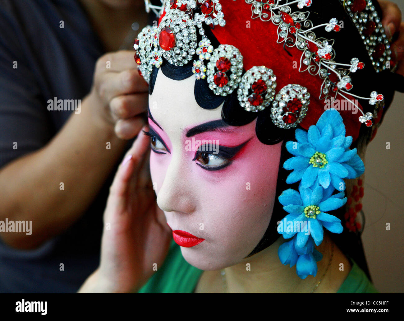 Peking opera performer wearing decorated hairpiece, Beijing, China Stock Photo