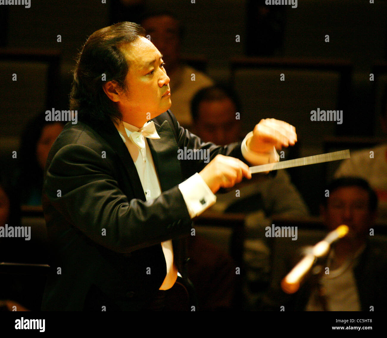 Man conducting an orchestra, Beijing, China Stock Photo