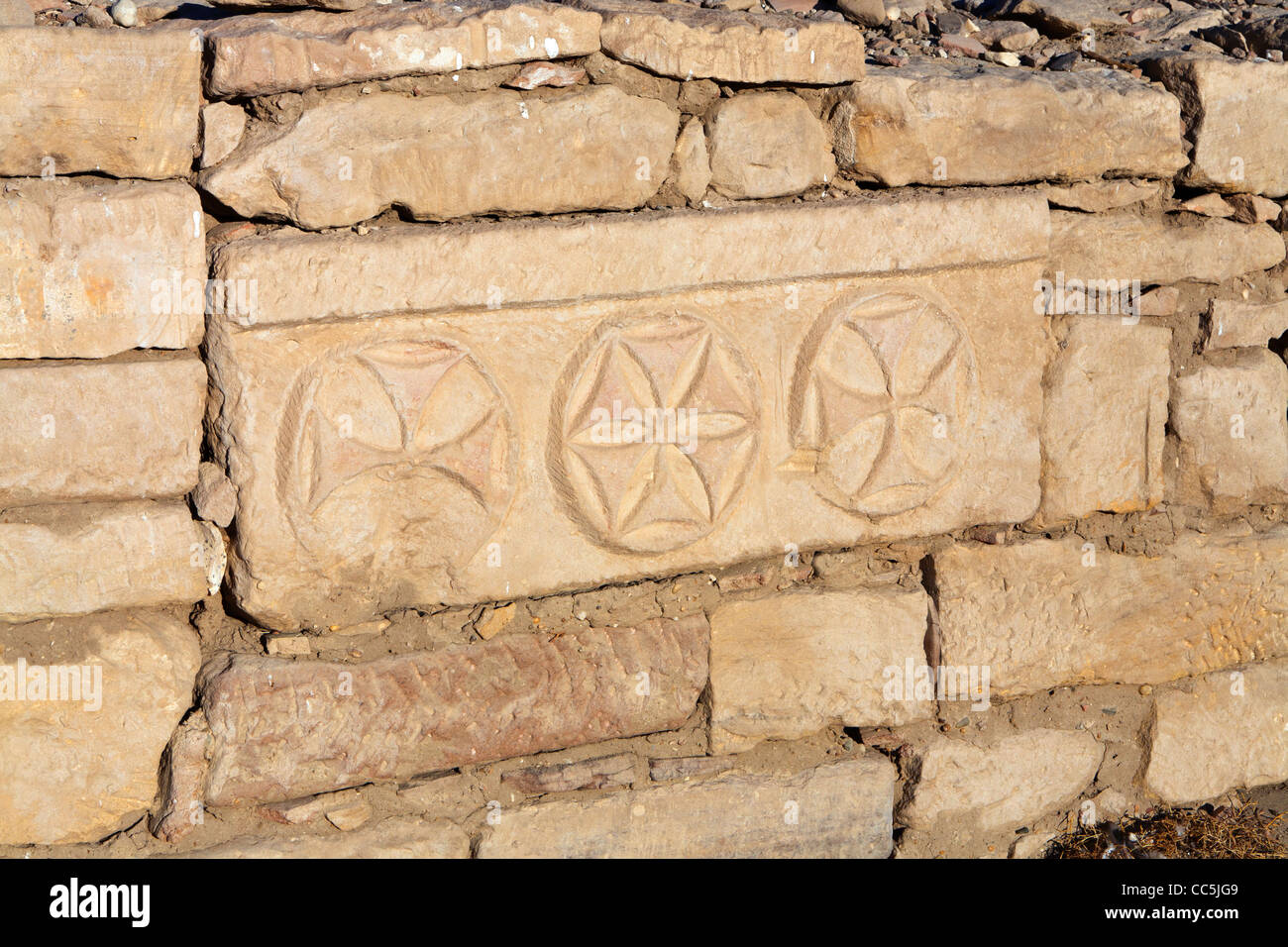 View of  Christian symbols on block in the  Mortuary Temple of Pharaoh Ramesses III, Medinet Habu, West Bank, Luxor, Egypt Stock Photo