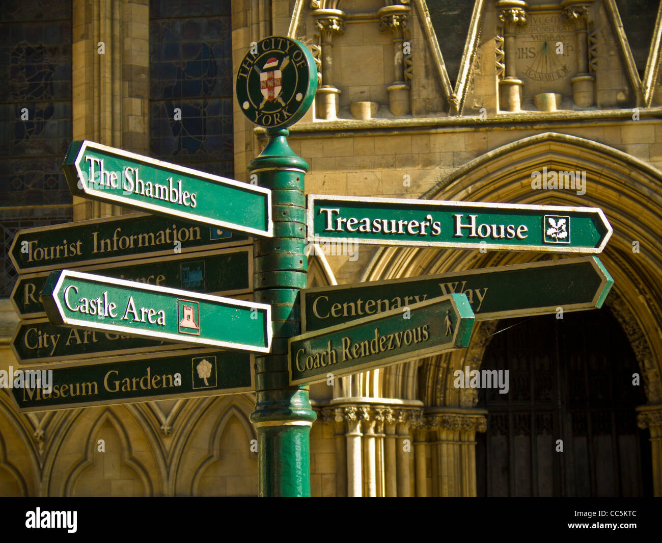 Signpost with signs to York’s tourist attractions in front of York Minster. Stock Photo
