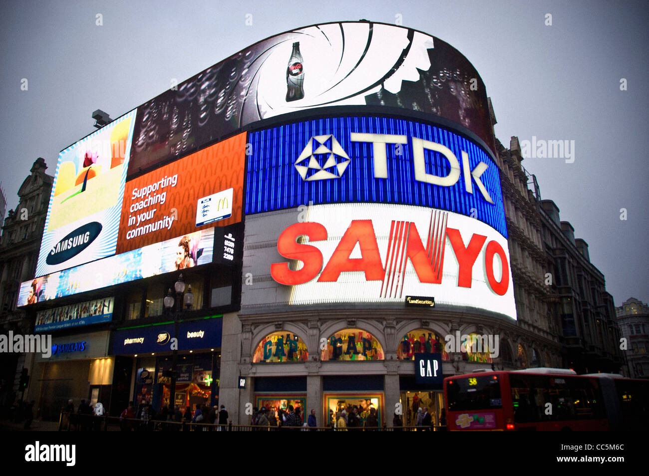 Illuminated neon advertising signs at Piccadilly Circus in London, at dusk. Stock Photo