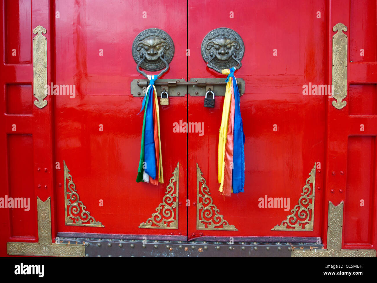 Handle with colorful ribbons on closed door, Genghis Khan Mausoleum, Ordos, Inner Mongolia, China Stock Photo