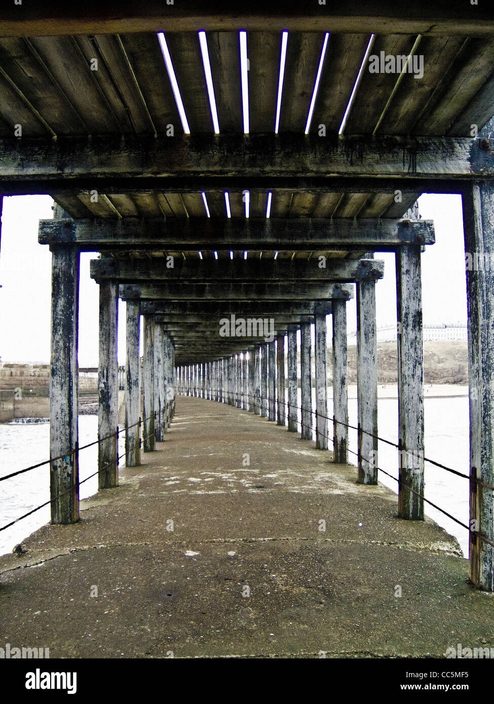 Weathered wooden beams on underneath of the west pier at Whitby harbour, North Yorkshire, UK. Stock Photo