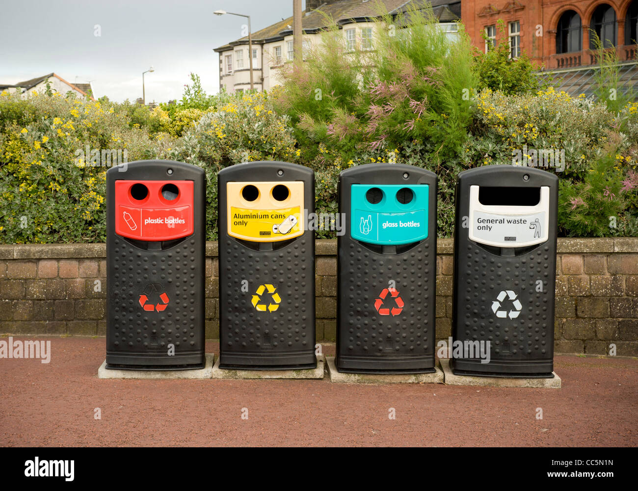 Row of sorted recycling and general waste bins in a UK town centre Stock Photo