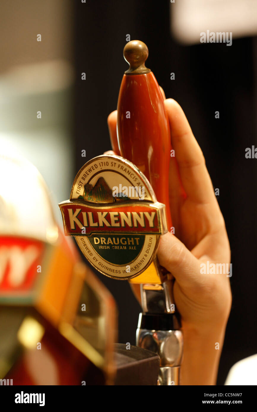 A beer tap displays the Irish Kilkenny beer logo Stock Photo Alamy