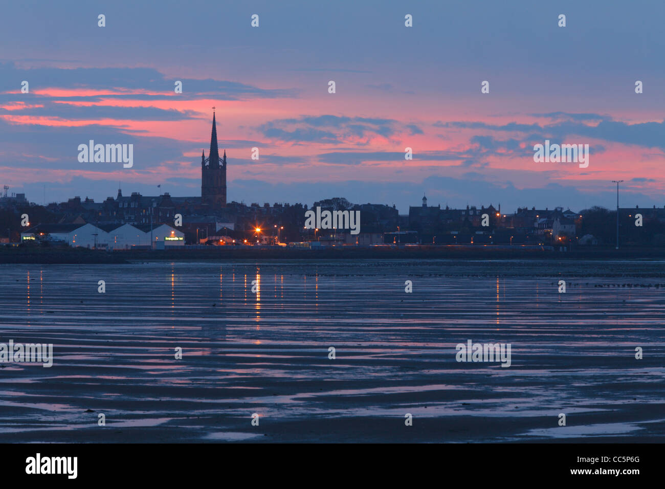 Part of the Montrose Basin before dawn. Mudflats and Montrose with roosting Pink-footed Geese. Montrose, Angus, Scotland. Stock Photo