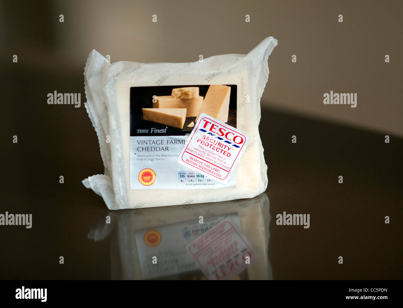 Tesco cheddar cheese with security tag Stock Photo Alamy
