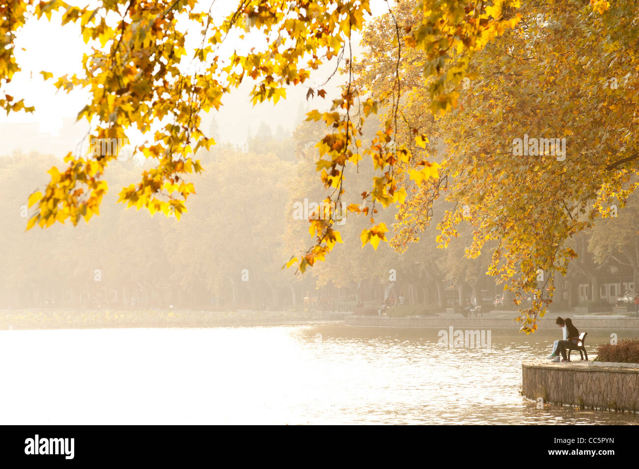 Chinese people resting beside West Lake, Hangzhou, Zhejiang , China Stock Photo