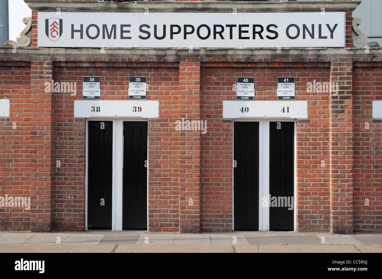 Traditional turnstiles for home supporters on Stevenage Road, Craven Cottage, home of Fulham Football Club, West London, UK. Stock Photo