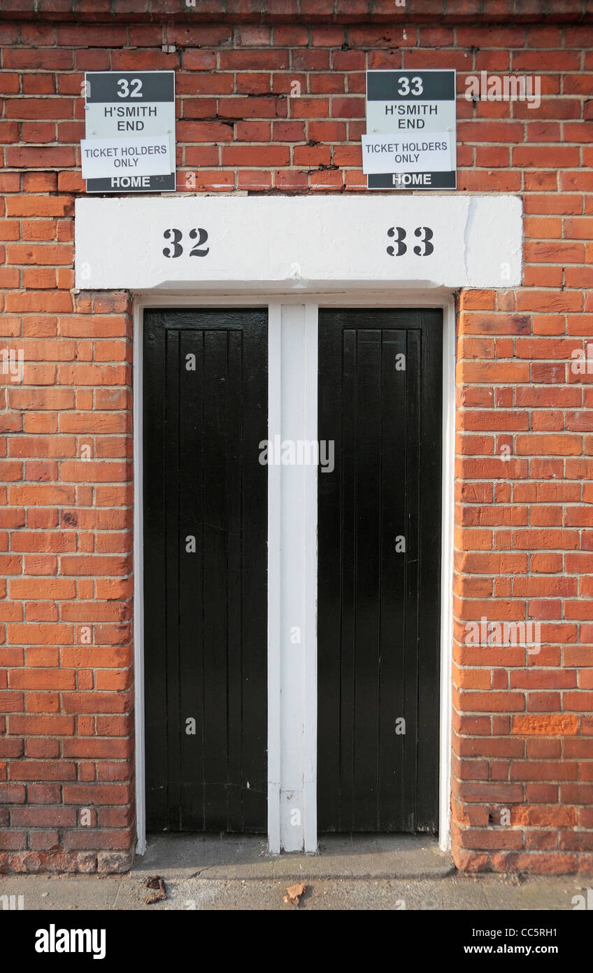 A pair of traditional turnstiles on Stevenage Road, Craven Cottage, home of Fulham Football Club, West London, UK. Stock Photo