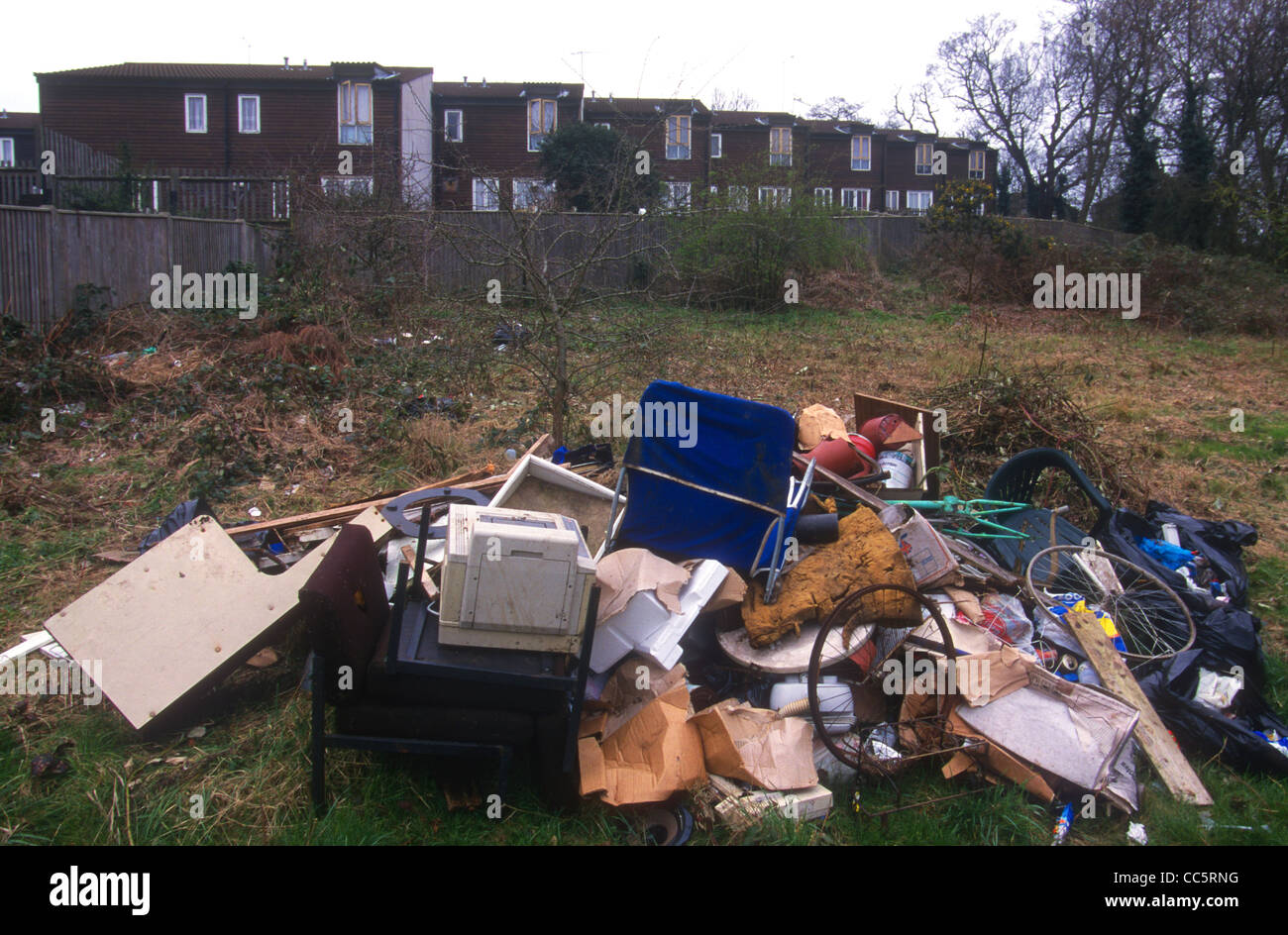 Discarded rubbish adjacent to a council housing estate, Lambeth, London