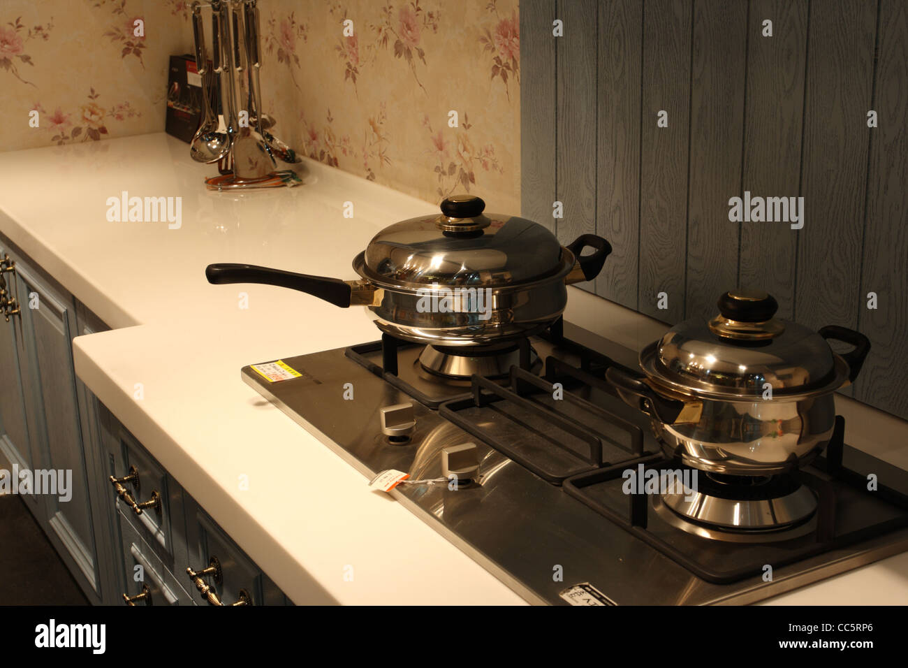 Boiler and frying pan on stove in kitechen Stock Photo
