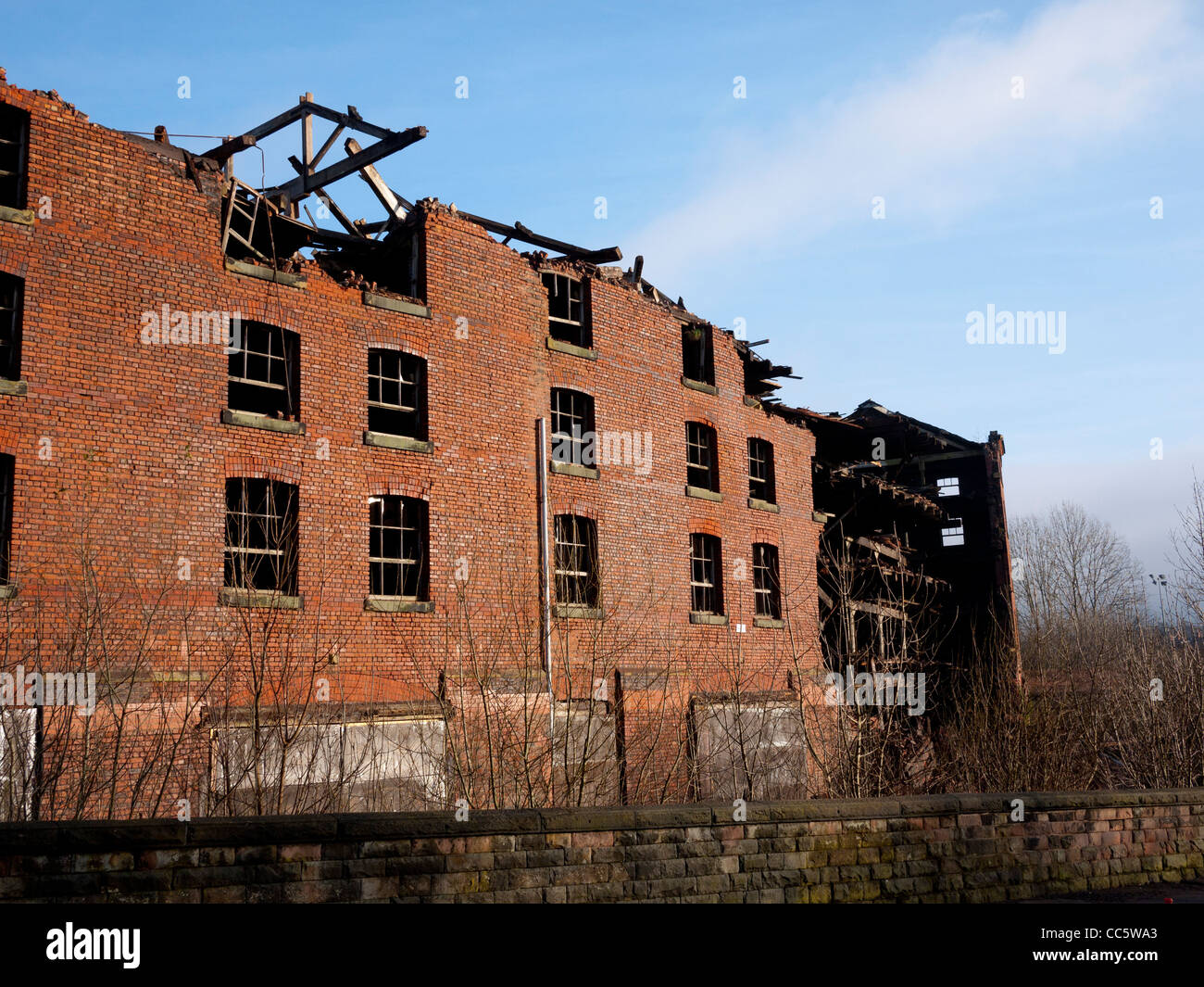 Old warehouse being demolished, Oldham, Lancashire, England, UK Stock