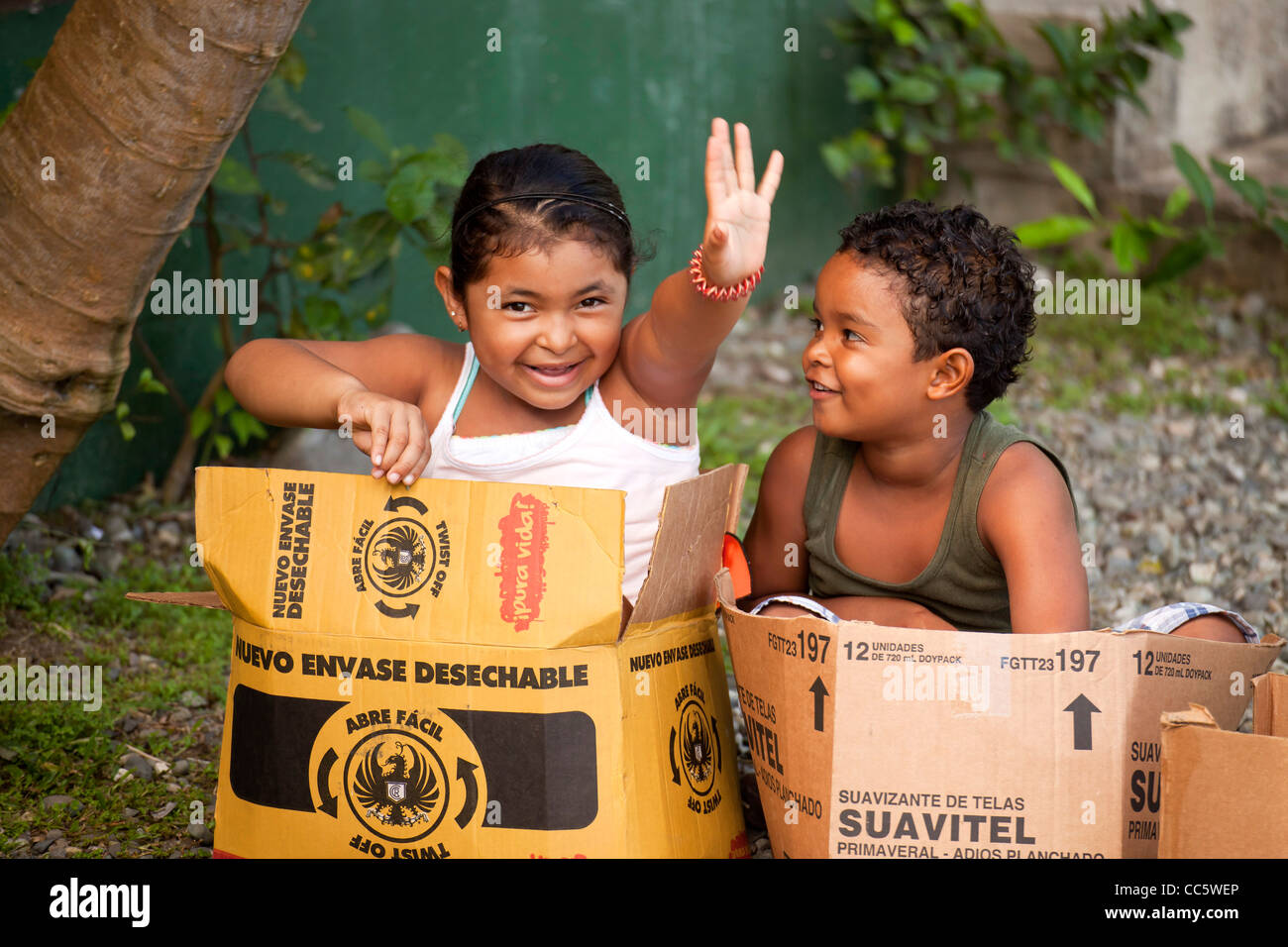 local children playing in a carton, Cahuita, Costa Rica, Central America Stock Photo