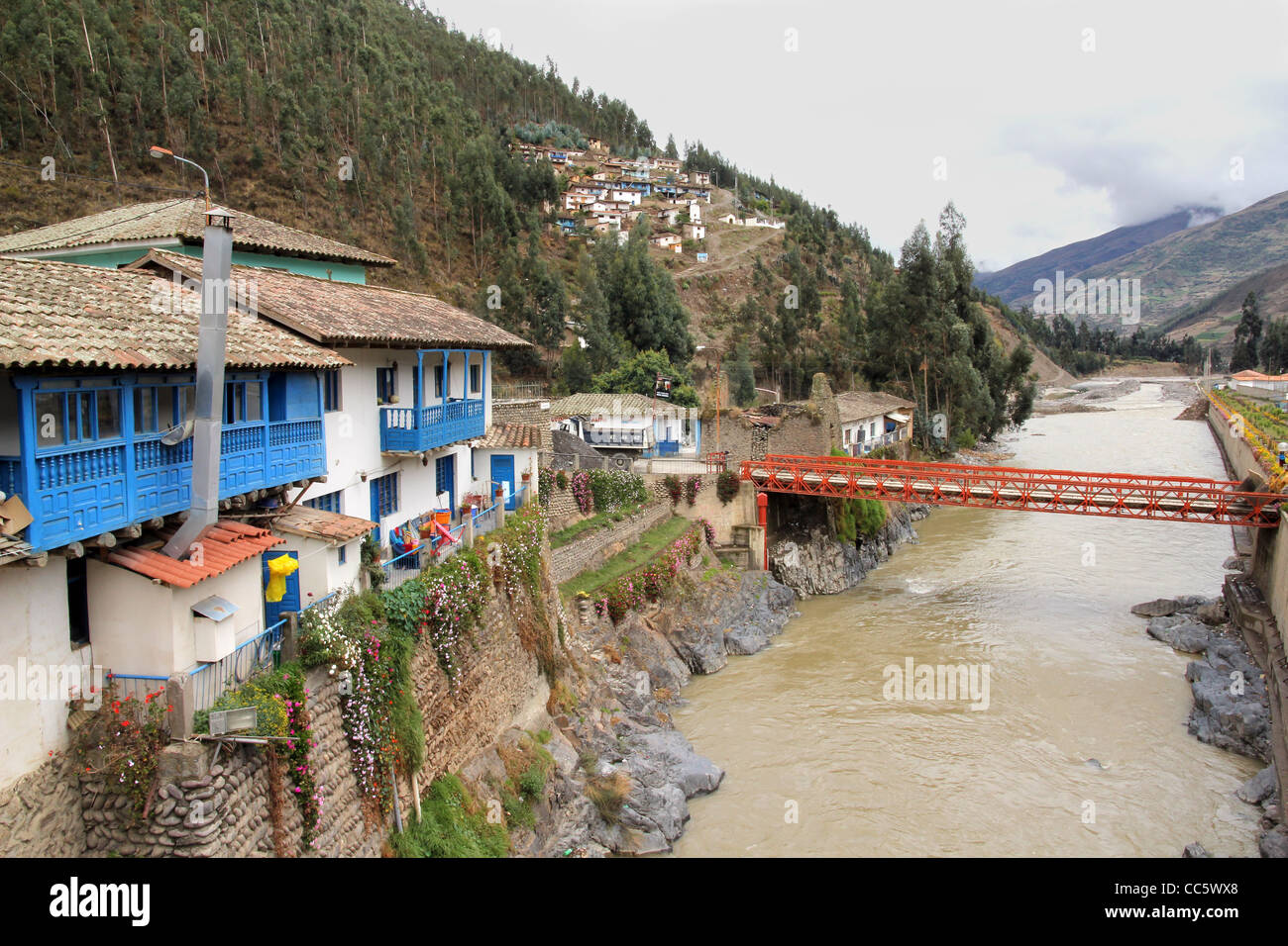 A lovely small mountain village along a river in the Andes Mountains, Peru Stock Photo