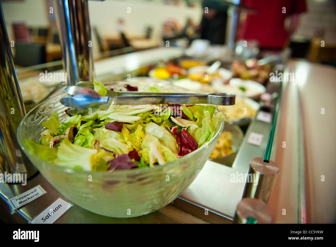 Buffet counter of salad cold meats fruits rice and pasta Stock Photo