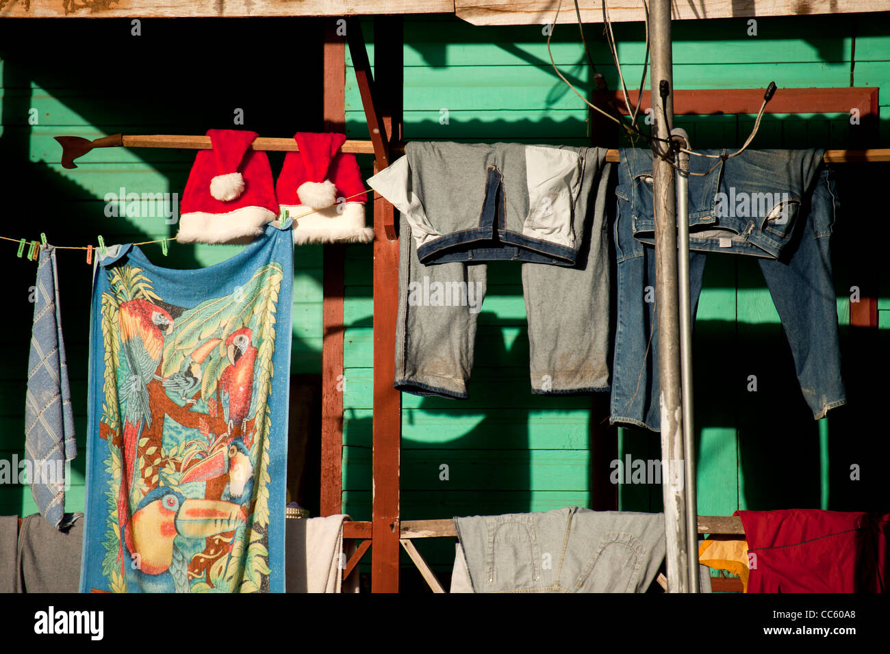 Christmas in the Caribbean, clothes line with Father Christmas hats in the small village Cahuita, Costa Rica Stock Photo