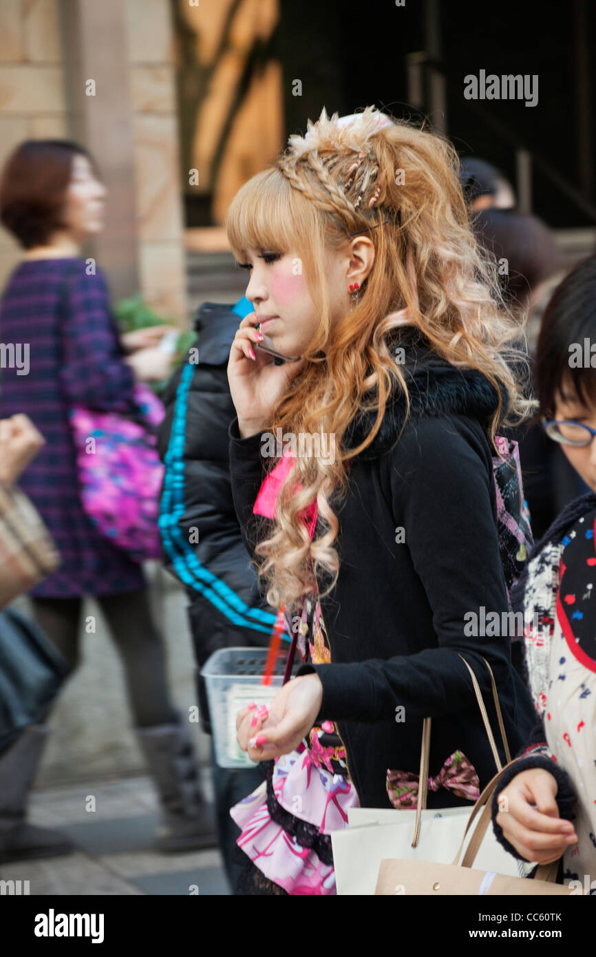 Japan, Tokyo, Harajuku, Takeshita Dori, Teenage Girl on Mobile Phone Stock Photo