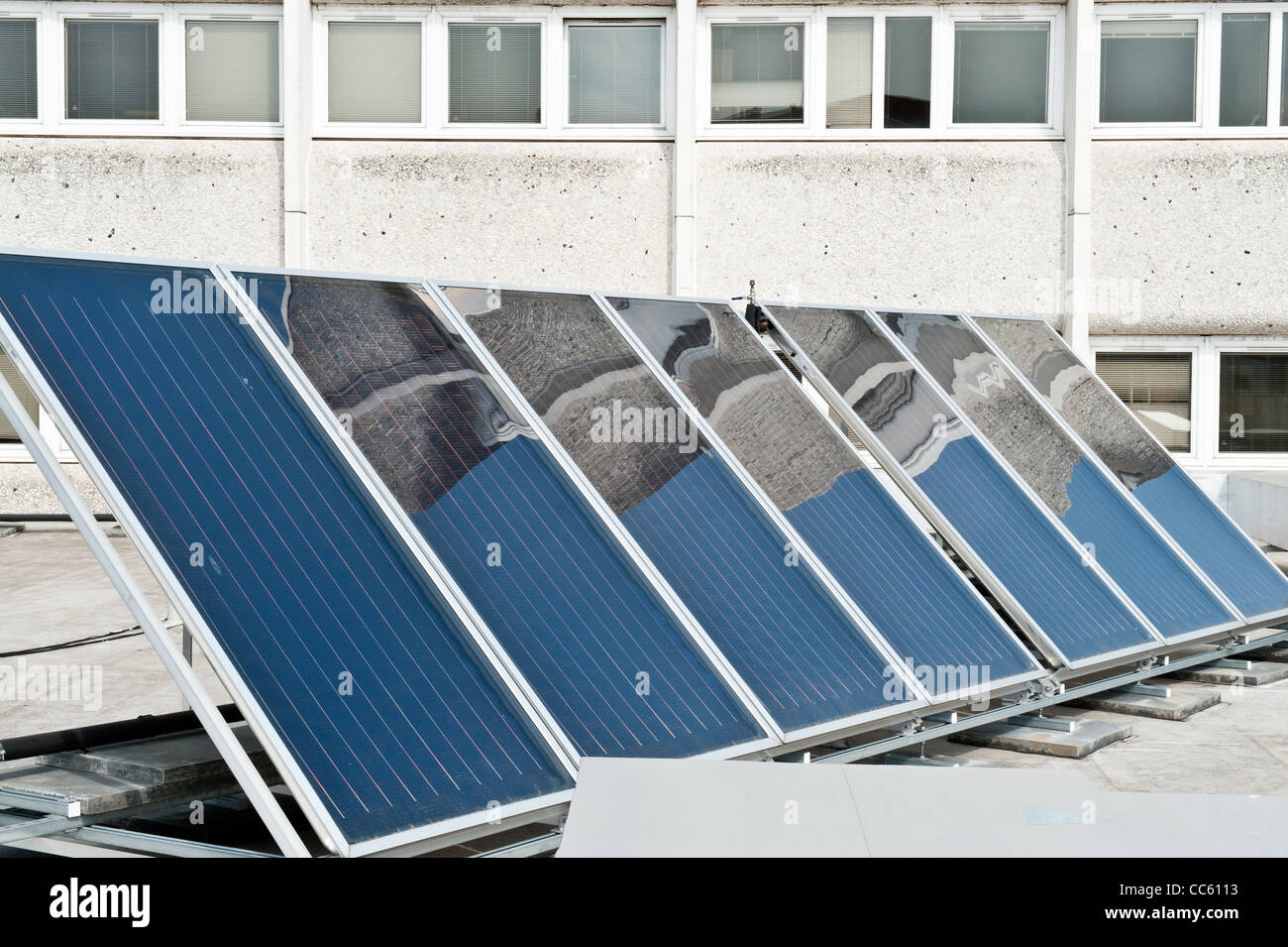 Solar panels for solar water heating on a rooftop. Stock Photo