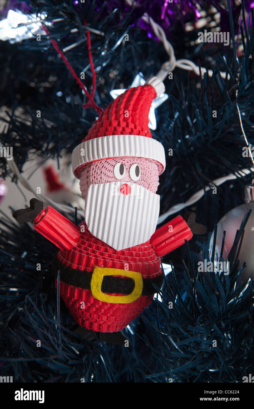 Close-up of a Santa decoration on a Christmas tree Stock Photo