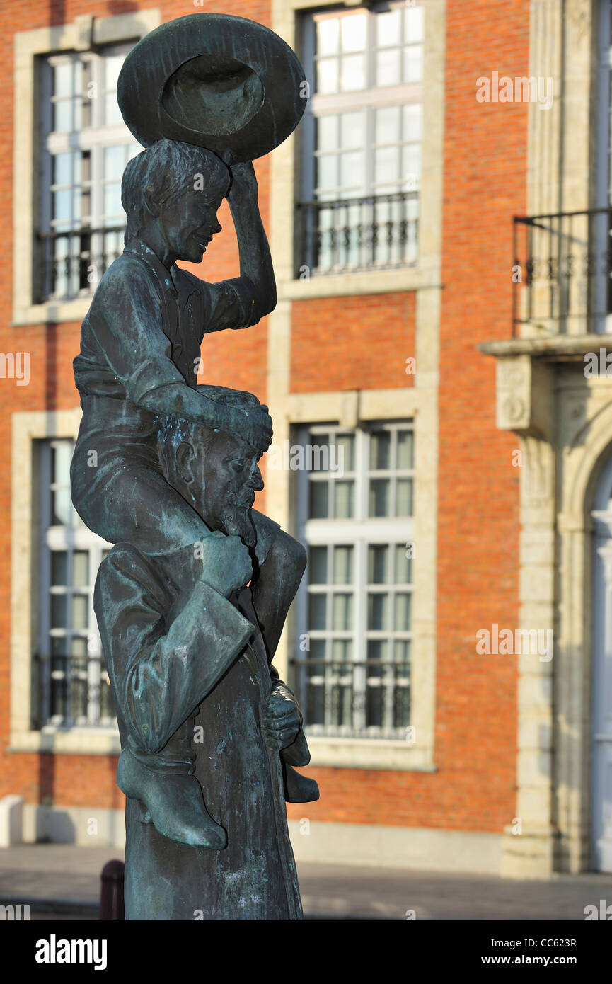 Statue of Flemish author Ernest Claes carrying De Witte van Zichem on his shoulders, Belgium Stock Photo