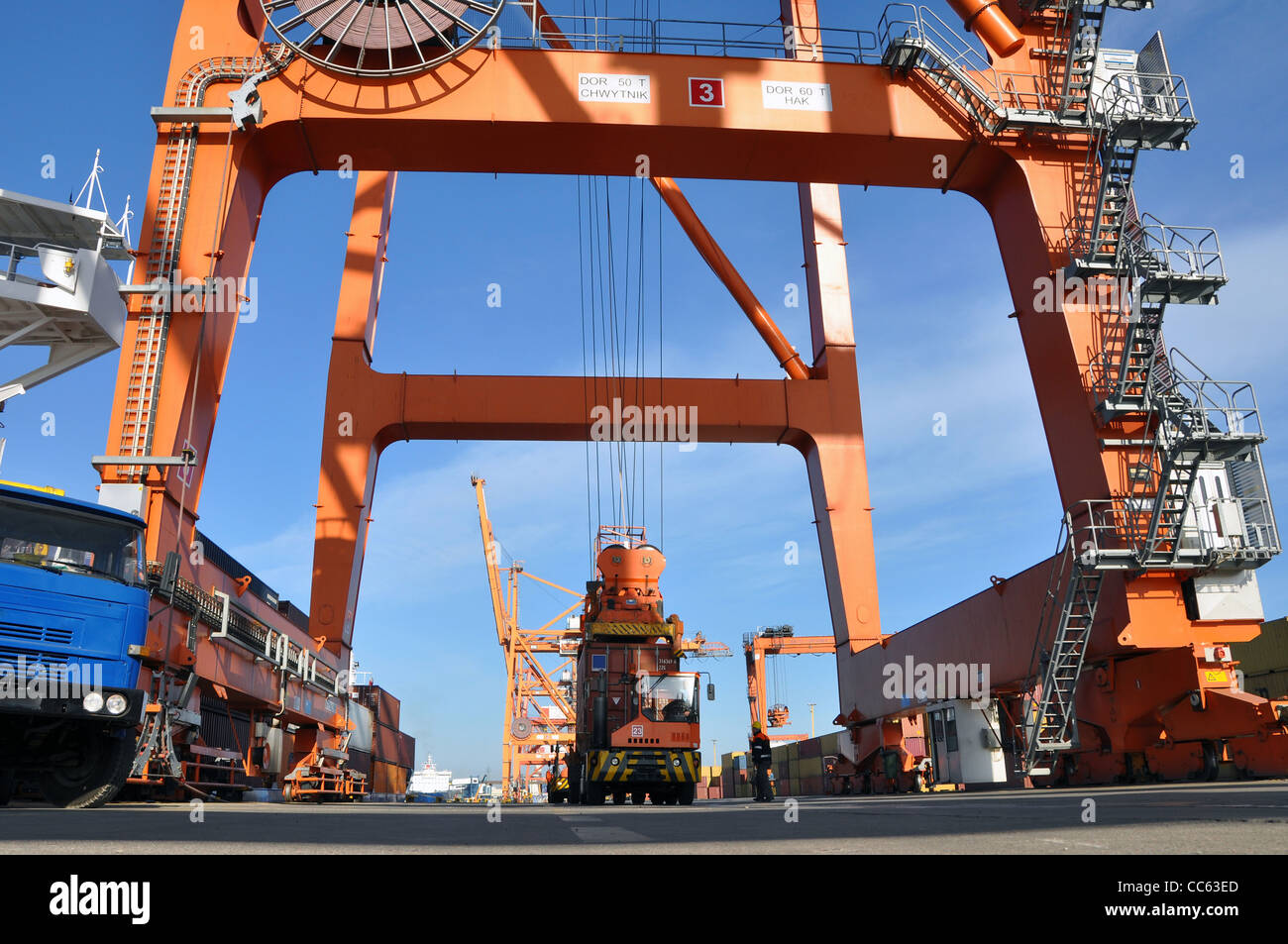 crane loading a containeron a lorry on a container terminal Stock Photo ...
