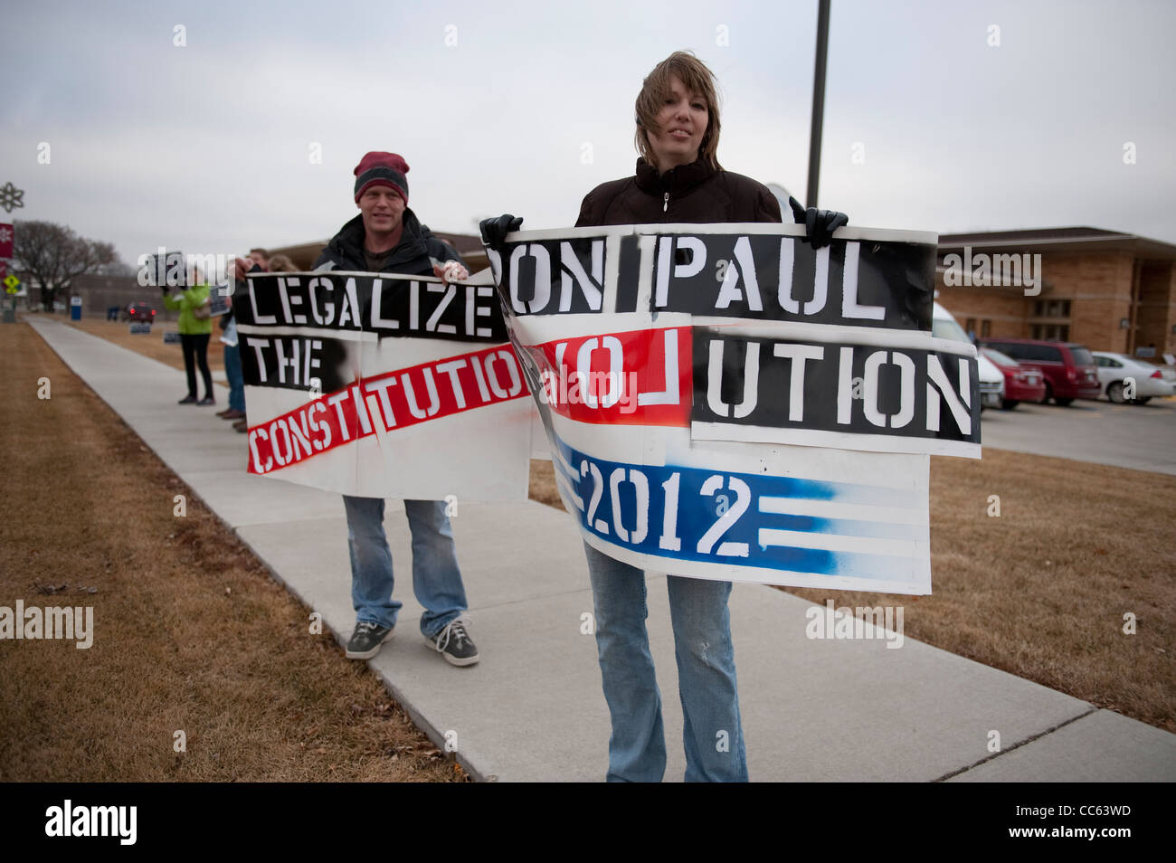 Republican presidential nominee candidate Ron Paul's supporters wave signs outside a campaign stop in Sioux Center, Iowa Stock Photo