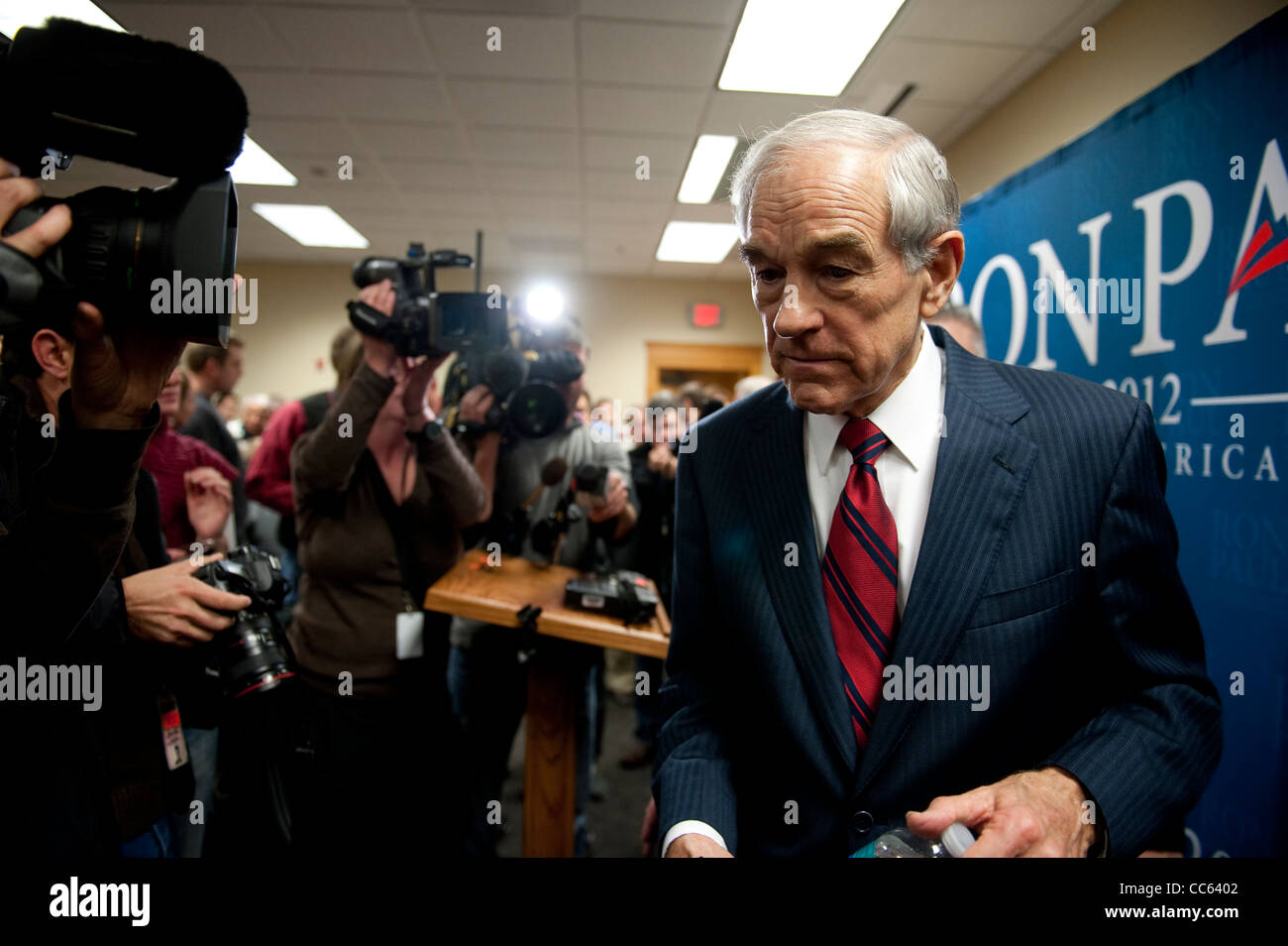 Republican presidential nominee candidate Ron Paul, surrounded by video cameras, walks to a campaign stop in Sioux Center, Iowa Stock Photo