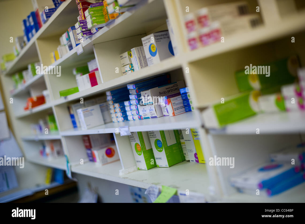 dispensary chemist display shelves of drugs and packets Stock Photo