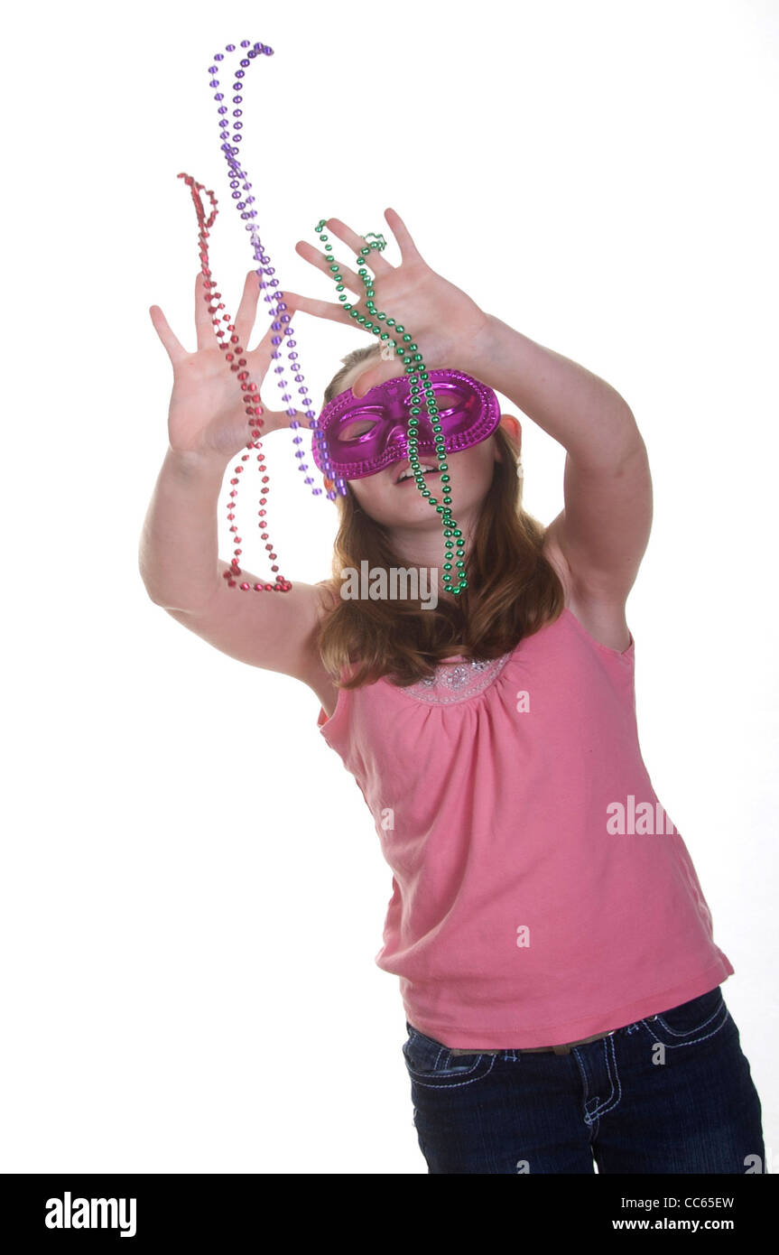 Girl catching mardi gras beads Stock Photo