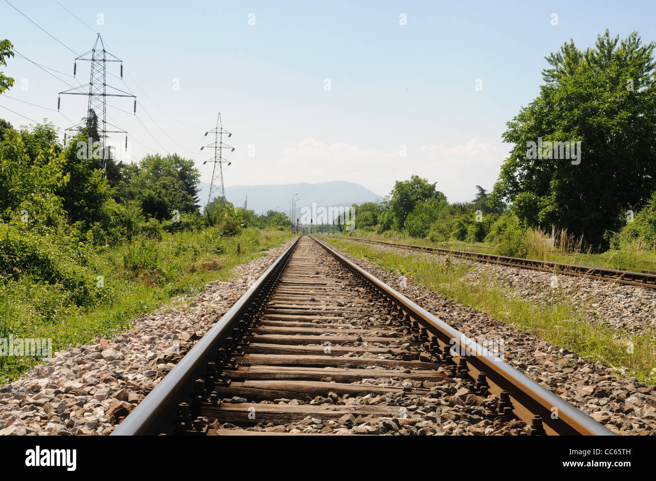 Railroad track vanishing into the distance Stock Photo