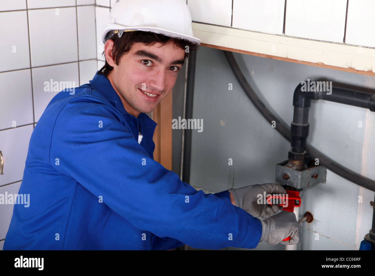 Mini Plumber Work junior plumber at work Stock Photo - Alamy