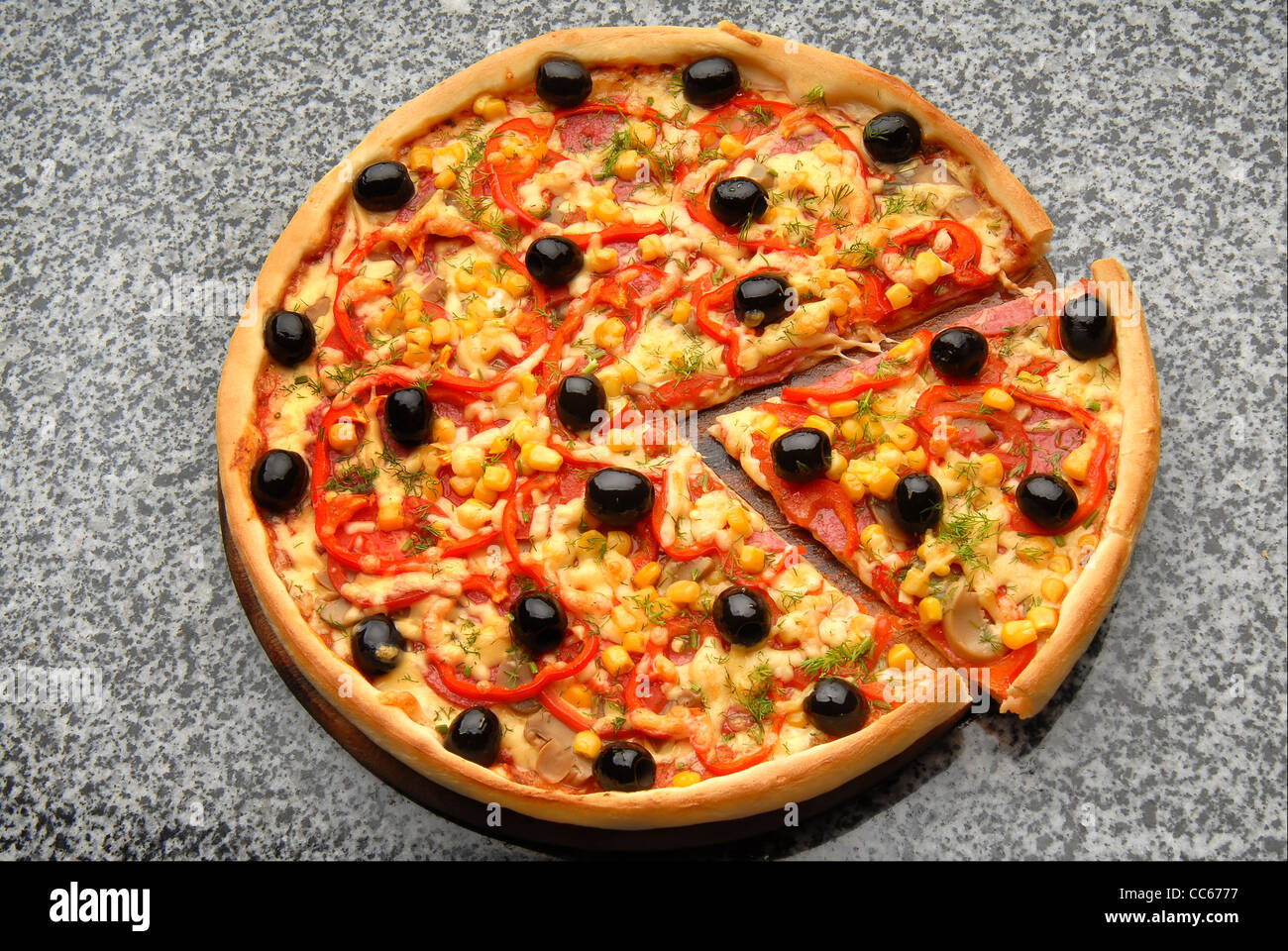 Round Italian pizza with salami, olives, capsicum and cheese Stock