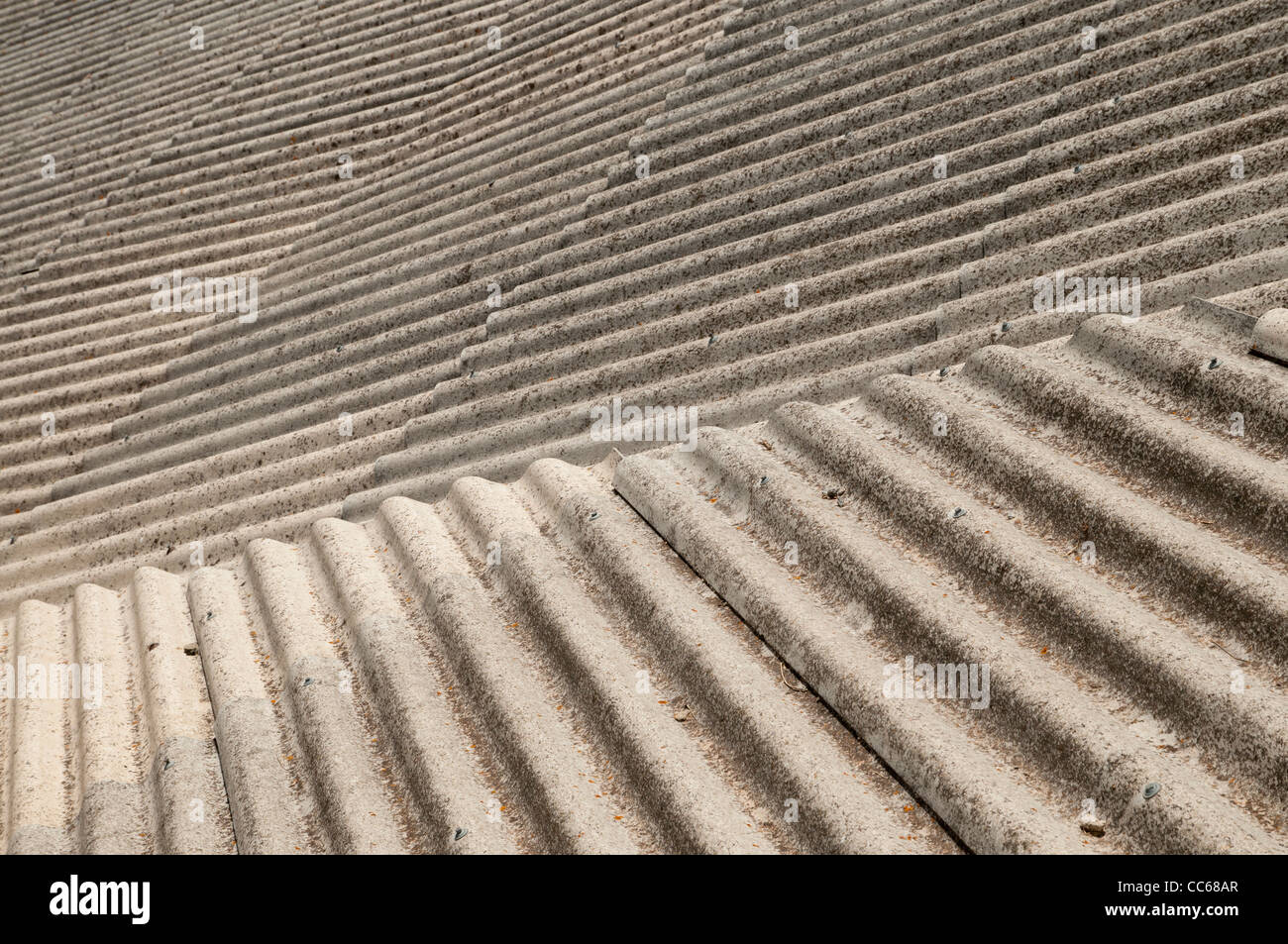 Corrugated asbestos and cement roofing material covering a backyard, Spain Stock Photo