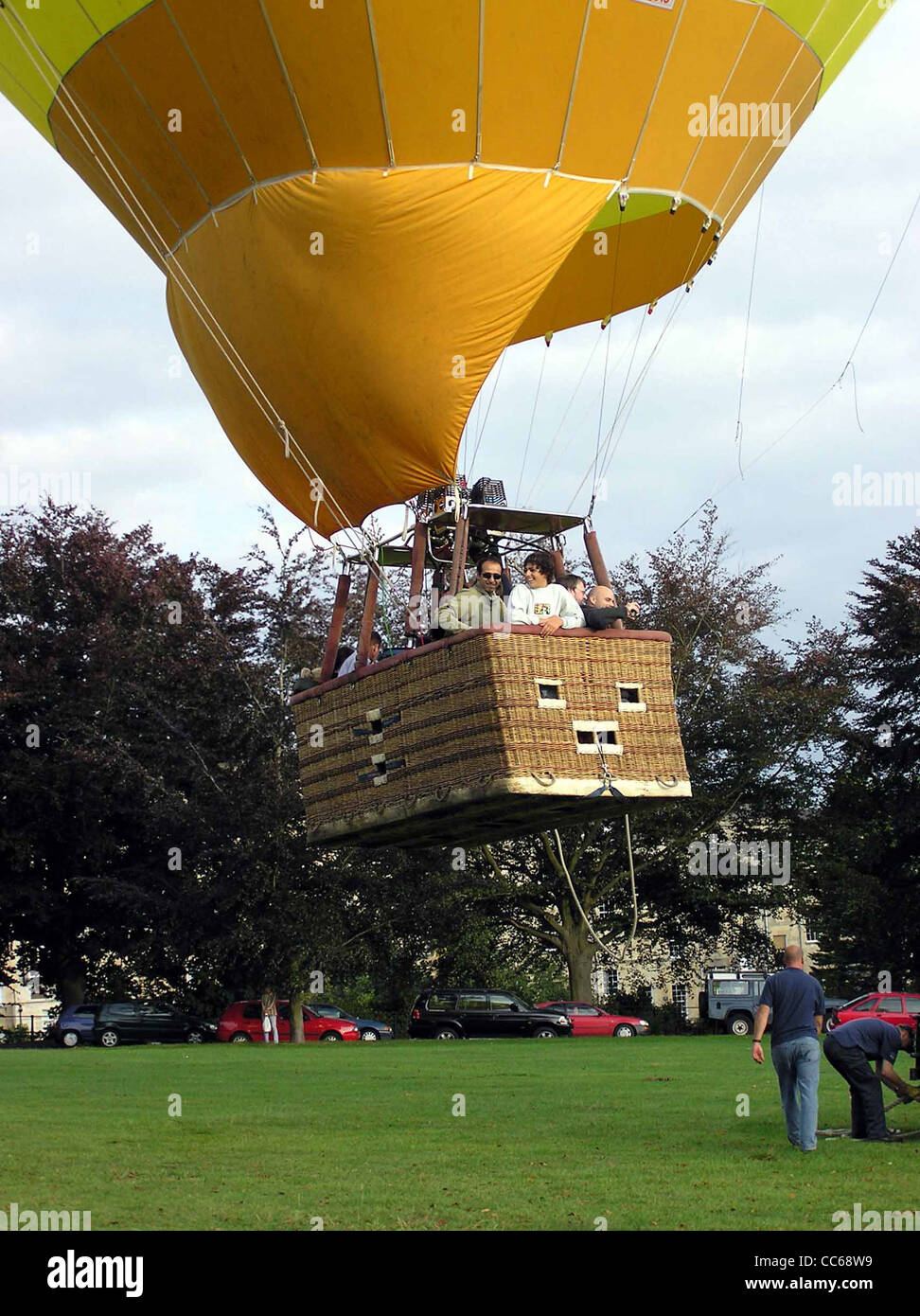 A hot air balloon lifts off in the evening, from Royal Victoria Park, Bath, England. Stock Photo