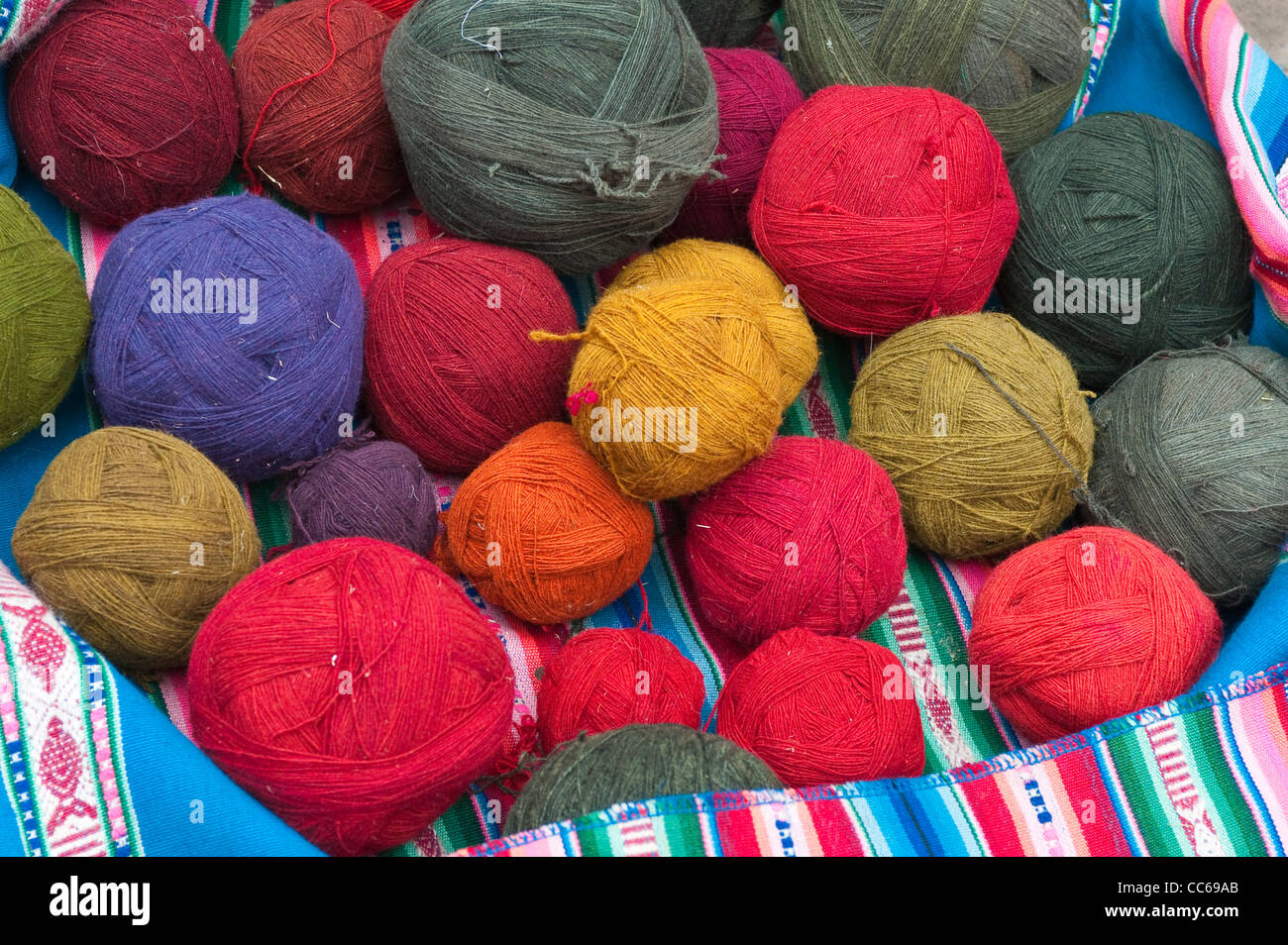 Peru, Chincheros. Dyed llama wool at the local artisan coop workshop. Stock Photo