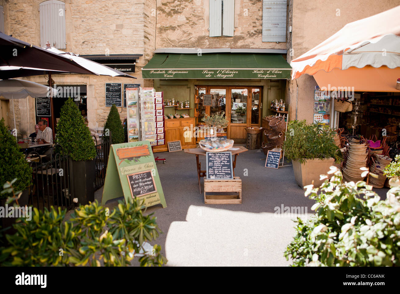 A row of restaurants, cafes, and shops in Gordes, France Stock Photo
