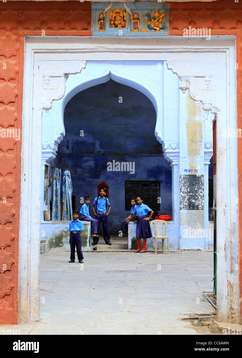 Schoolchildren under a blue archway . Bundi. Rajasthan. India Stock Photo