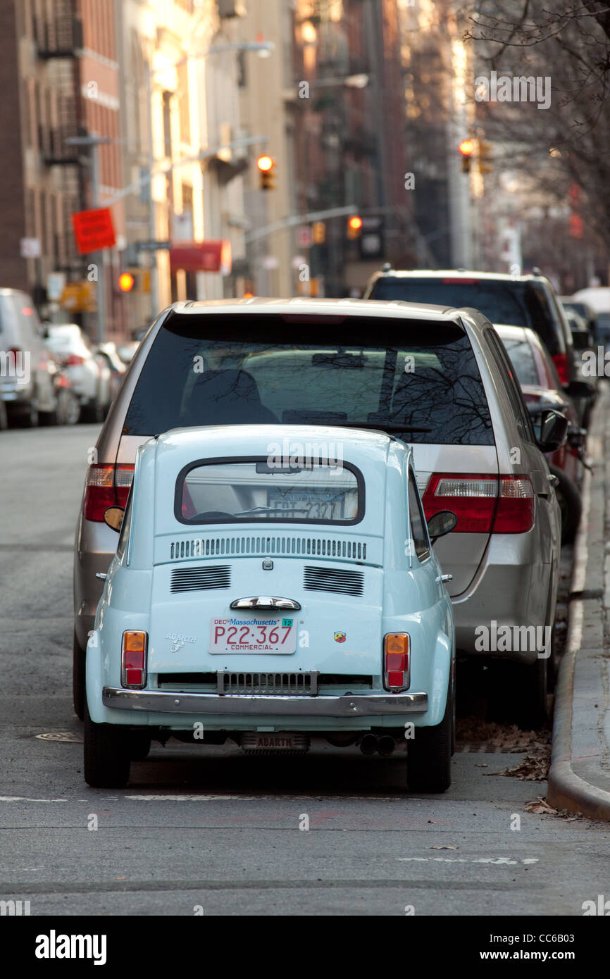A tiny car Fiat 600 parked on the street. Stock Photo