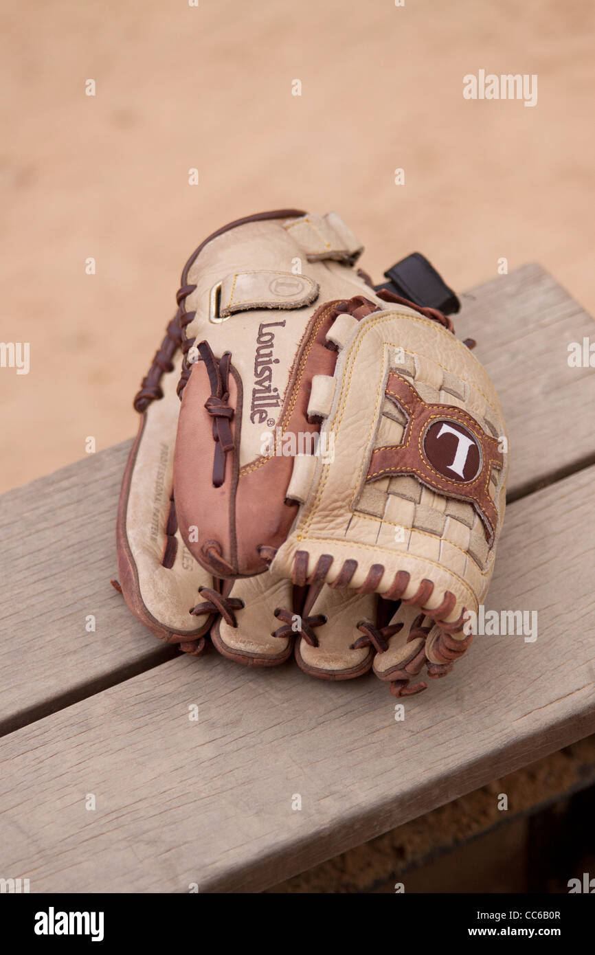 Baseball Glove on the bench Stock Photo