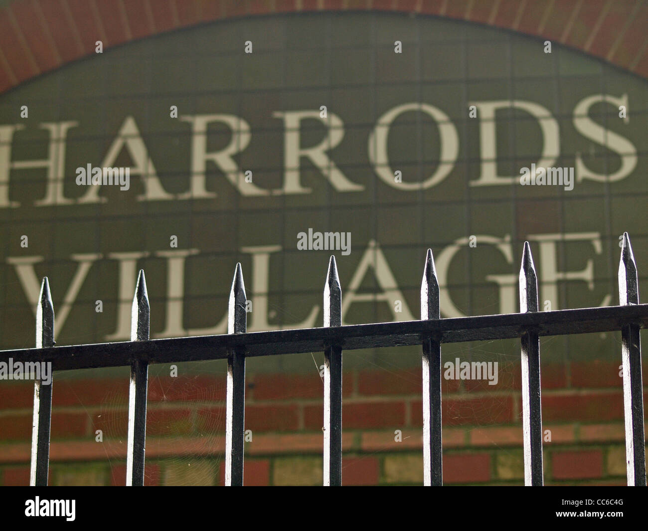 Security railing with sunlit spikes at Harrods Village Barnes London